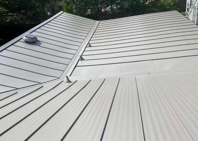 Solar attic fan installed on a metal roof for Roof Ventilation in Schiller Park